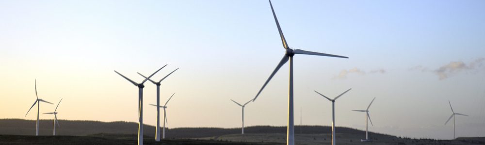 windmills-field-against-sky